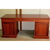 Red Mahogany Double Pedestal Desk Featuring Slide out Shelves Above Side Drawers for Extra Working Space 